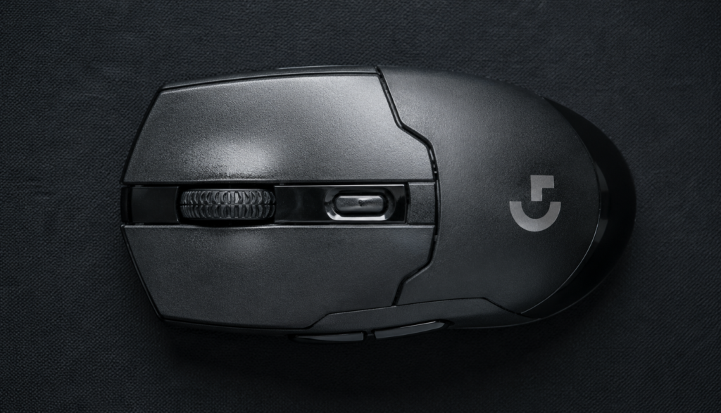 Close-up top-down view of gaming mouse left click button surface detail