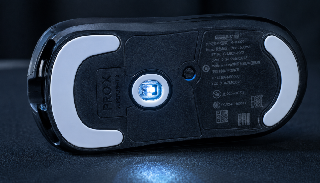 Macro close-up of a gaming mouse optical sensor and glide feet